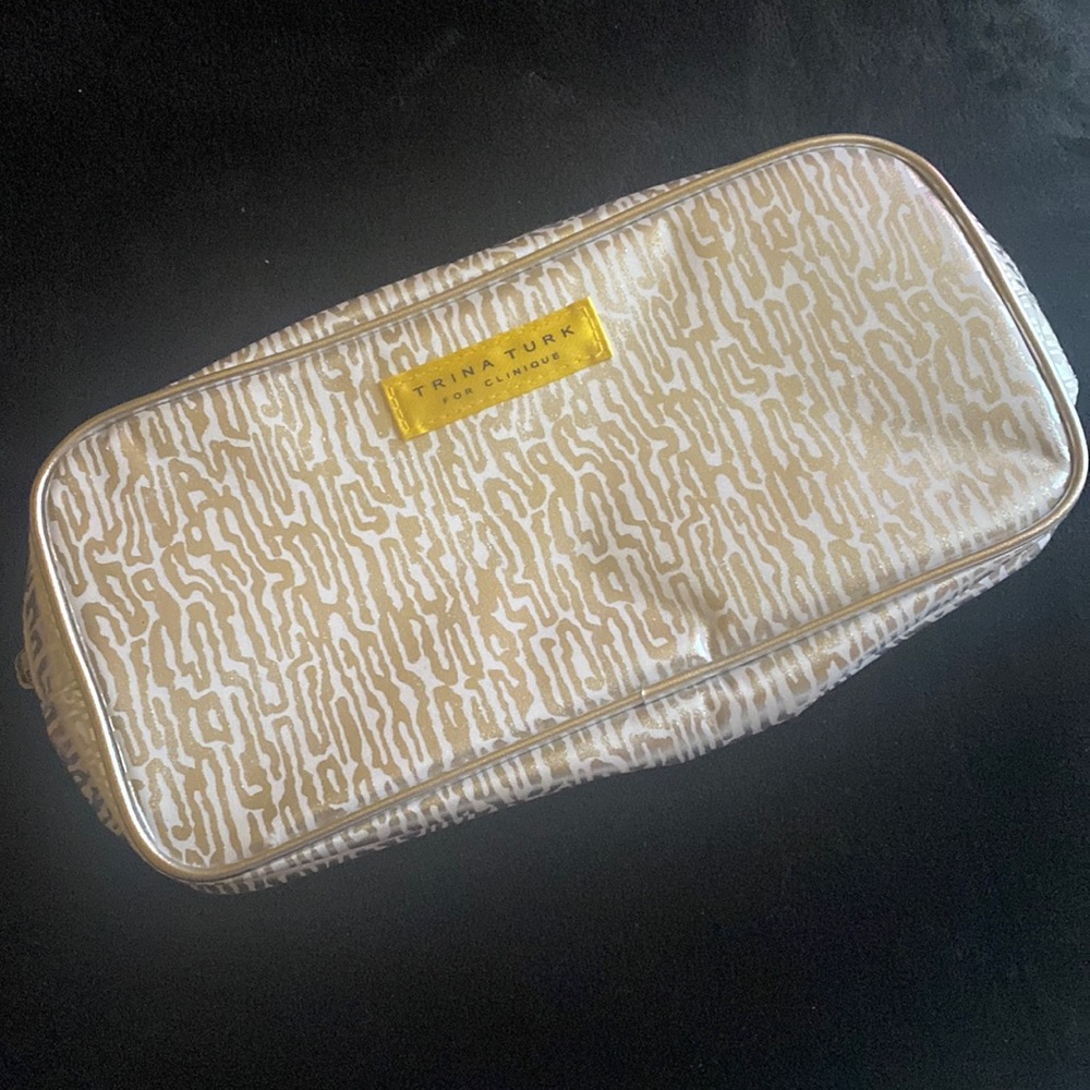 Grey zebra print pouch. It came be used for makeup, pencils, wallet, etc.
